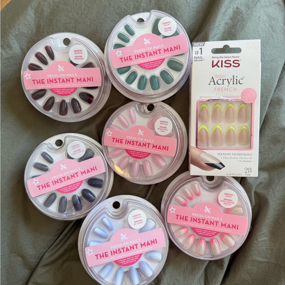 7 packs of press on nails. Olive and June and Kiss